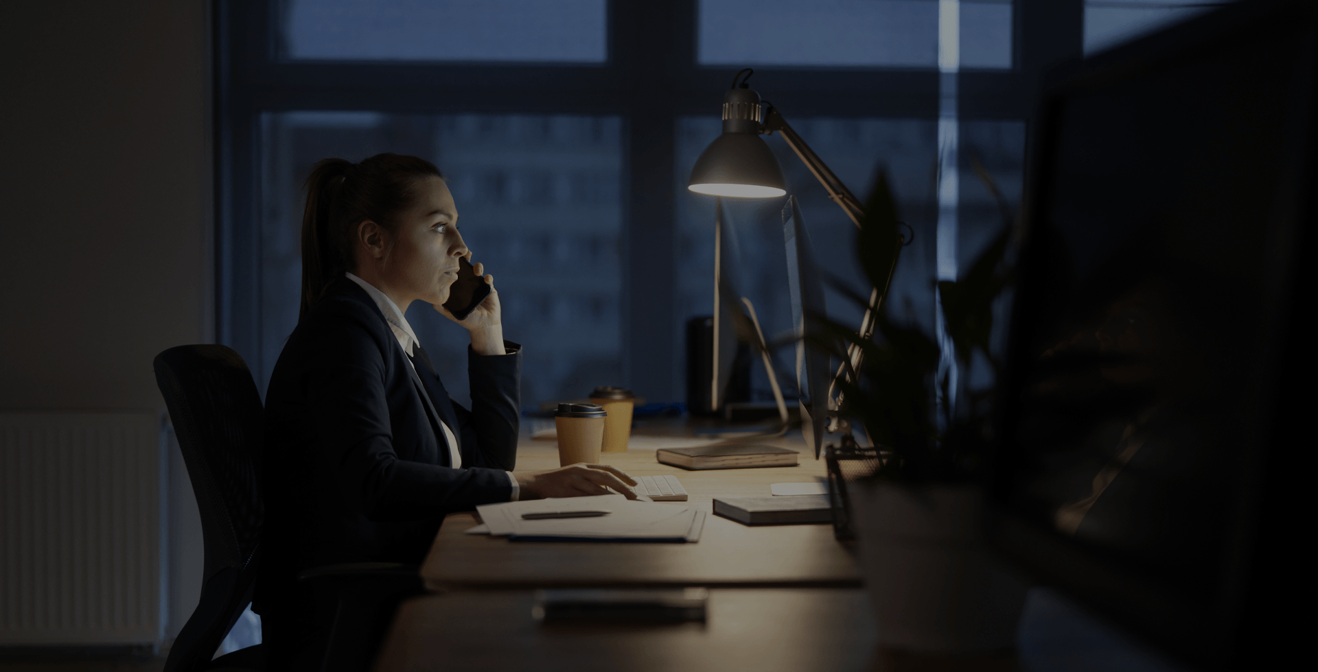 woman working late at her desk